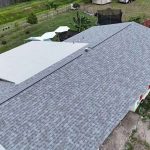 Home topped with newly installed shingles