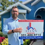 Person holding a sign for Titan Roofing
