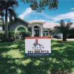 Property showcasing a Titan Roofing sign in the front yard