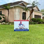 Titan Roofing sign displayed in the front yard