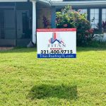 Titan Roofing sign posted outside the house