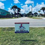 Titan Roofing signage by the roadside