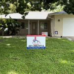 Titan Roofing signage displayed at the front of the home