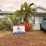 Titan Roofing signage visible in front of the house