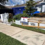 Titan Roofing signage with roofing supplies in the background