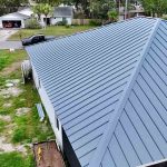 Elevated perspective of a house topped with metal roof