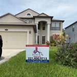 Signage displaying titanroofingfl.com